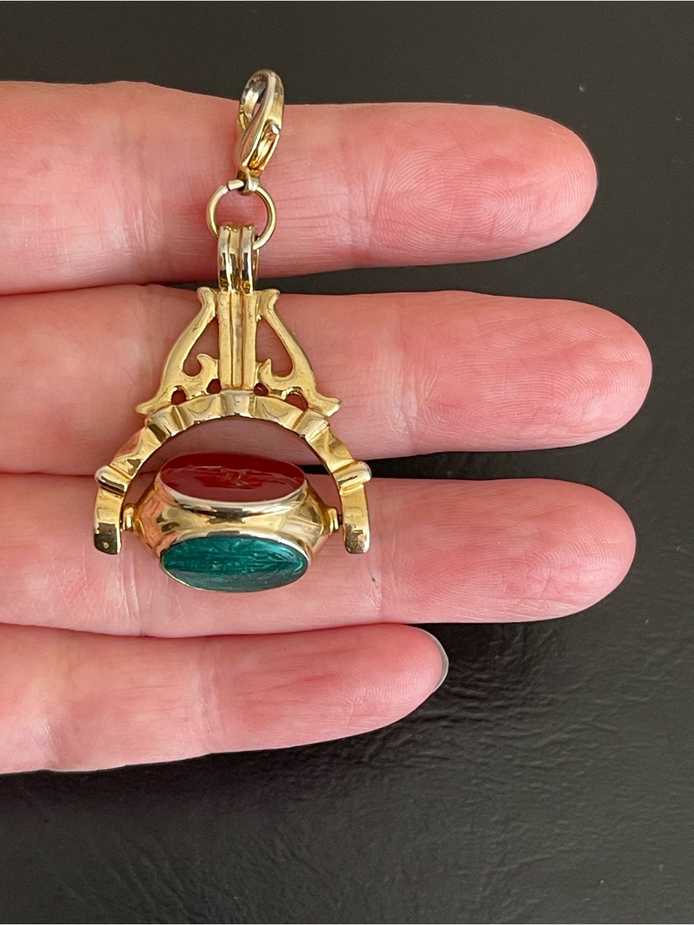 Vintage Gold tone three faced spinner fob pendant.